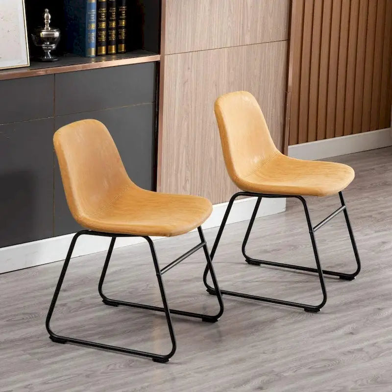 Mid-Century Tan Faux Leather Armless Dining Chair with Black Metal Sled Base