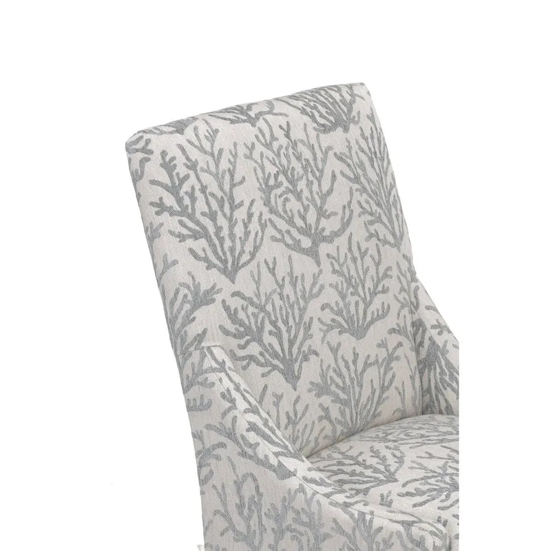 Silla de comedor tapizada con brazos de diseño transicional, patas de caucho y tela estampada